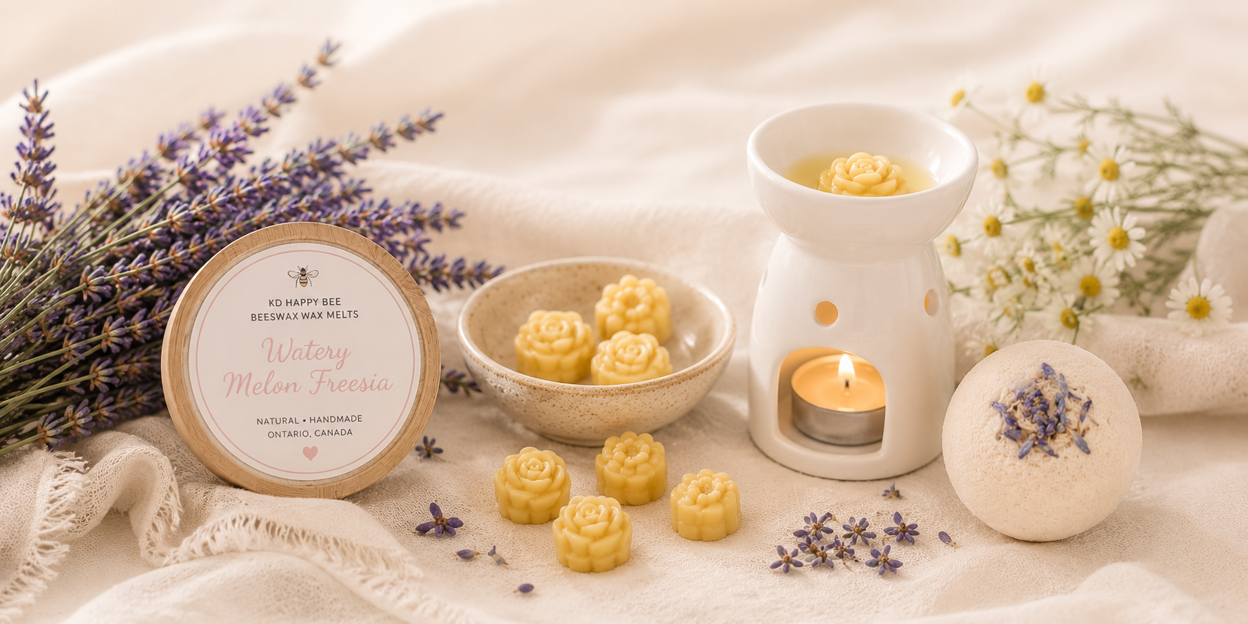 Bath bombs, a candle, and lavender flowers on a soft surface